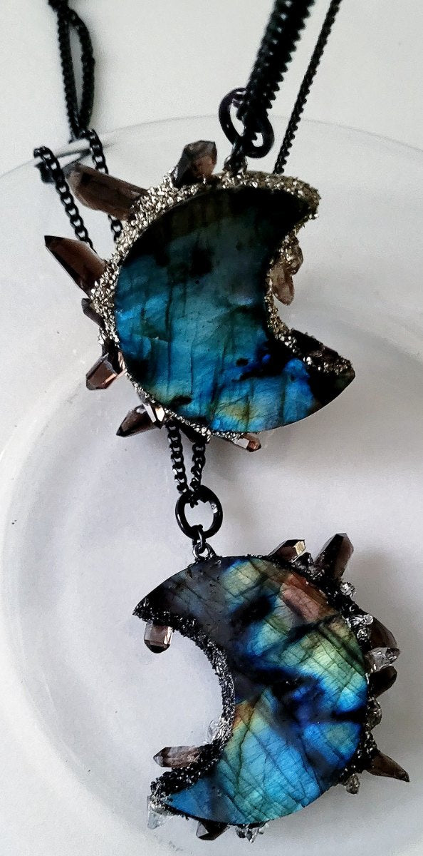 Labradorite discs showing shifting blue and gold flash across the polished surface