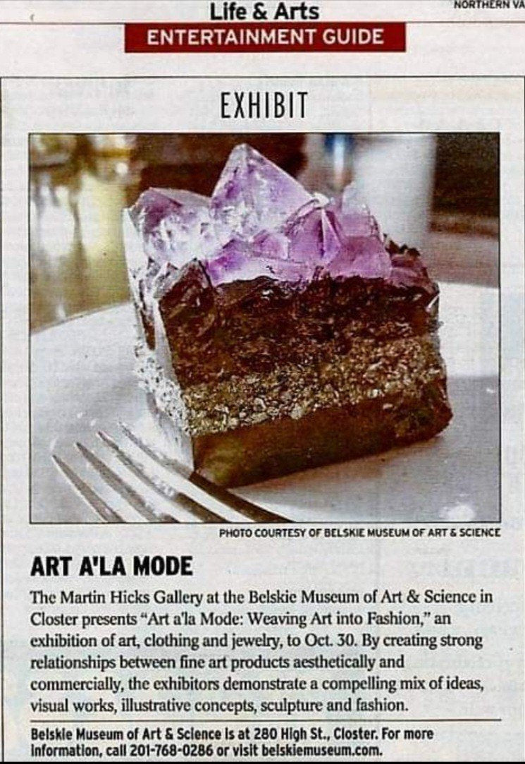 Newspaper notice for Art a’la Mode at the Belskie Museum of Art & Science, showing a Cat Machine Gems gem cake